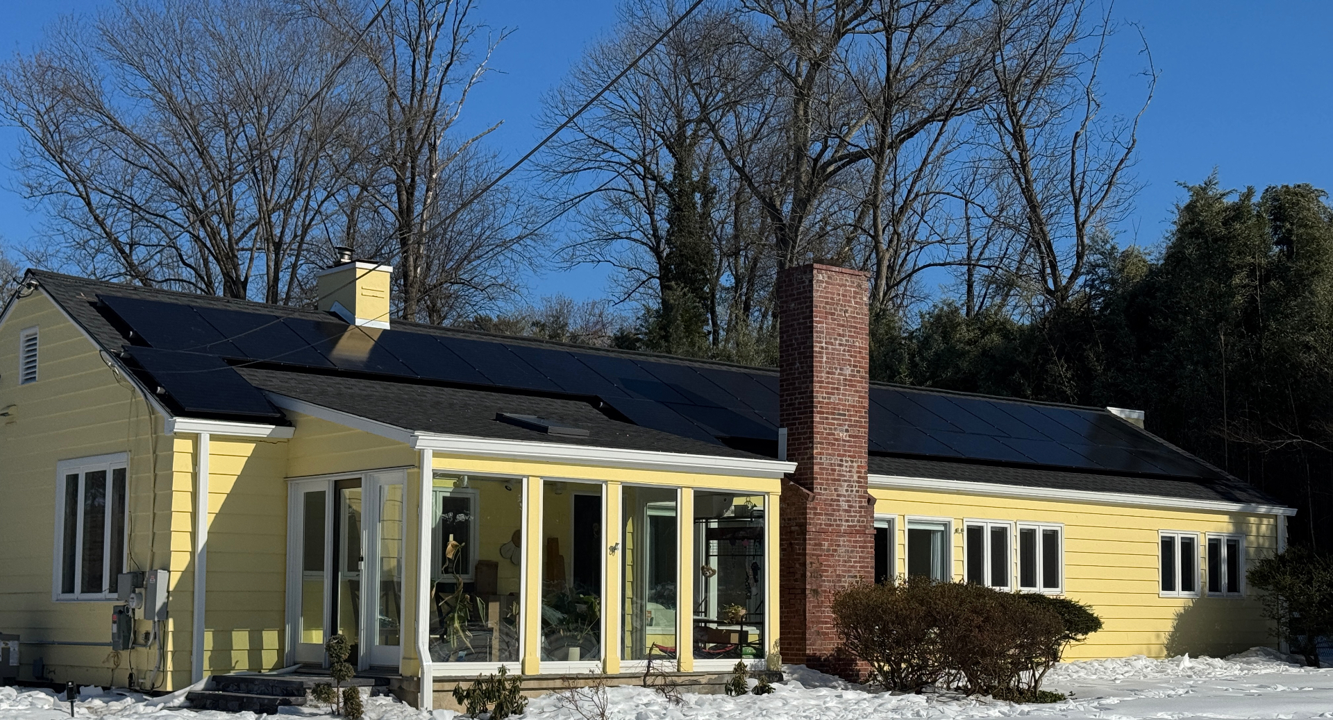 40 panel residential solar installation on a yellow home in Princeton, New Jersey