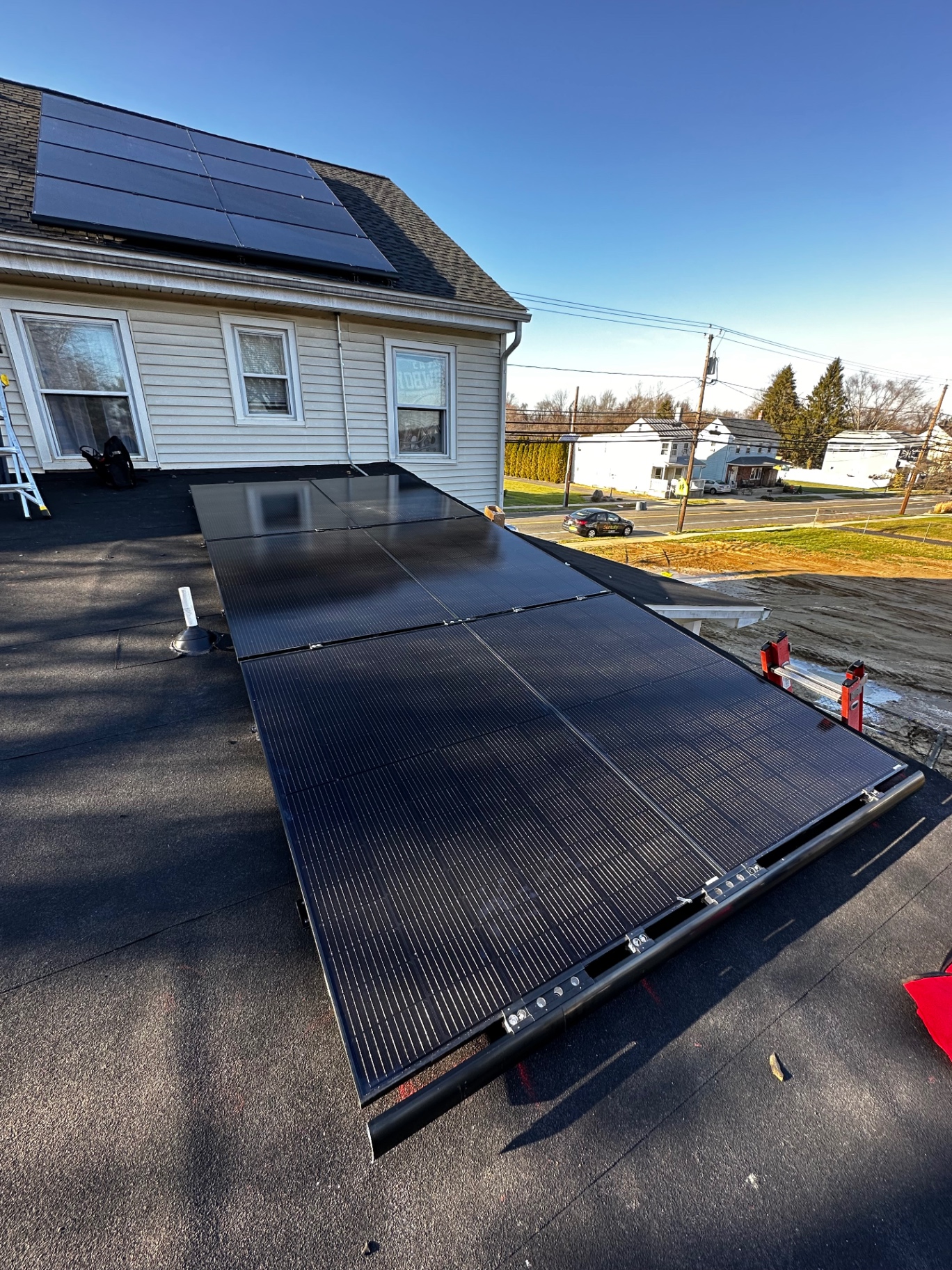 14 panel solar array installed on a flat roof section of a home in Mansfield Township, New Jersey