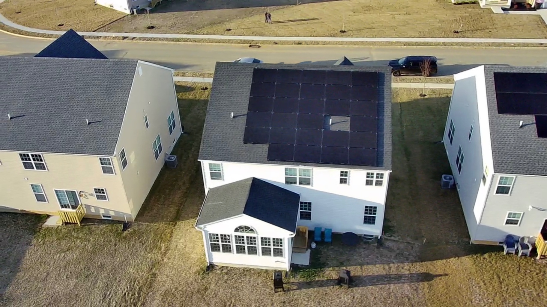 Aerial view of a 28 panel rooftop solar installation on a white home in Freehold, New Jersey